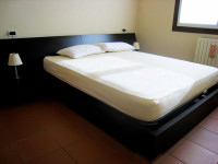 appartamento in vendita Cavezzo foto letto.jpg